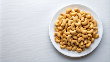 Sticker - Cashew nuts arranged neatly on a white plate, top view, Cashew nuts, healthy snack, nuts, plate