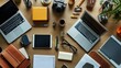 © Theeranan - A high-angle view of a modern business workspace with multiple devices and office accessories neatly arranged.