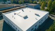 © orendesain99 - An aerial view of a flat roof on a commercial building