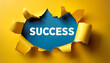 © hardvicore - Torn yellow paper revealing the word SUCCESS against bright blue background.