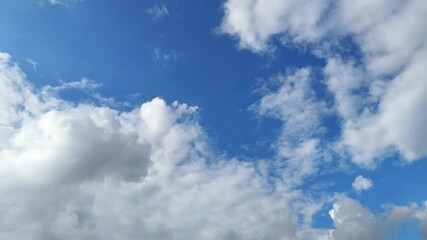 Wall Mural - 4K time-lapse of beautiful clouds with blue sky background, Blue sky with sun. cloud time lapse nature background