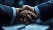 © Worakit - firm handshake symbolizes trust and agreement in professional setting, highlighting importance of negotiation and collaboration