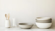© Isaac - A dining table set with plates, cutlery, and glasses, featuring a minimalist yet elegant design, perfect for promoting homeware products or lifestyle brands.