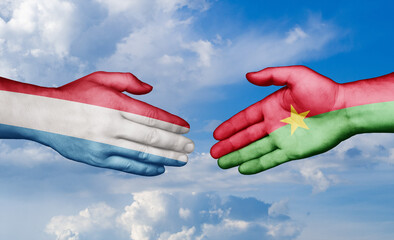 Burkina Faso and Luxembourg country handshaking with flags, consensus concept international co-operation illustration