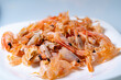 © Vadim - Freshly cooked shrimp served on a white plate.