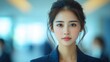 © PixelAI - Confident Asian Businesswoman Looking Directly at Camera