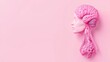 © Sweettymojidesign - Stylized pink model of a head showcasing brain and nervous system on pastel background.