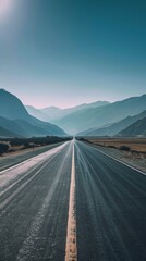 Poster - A long road with mountains in the background