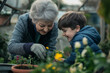 © Ирина Щукина - A woman and a boy are planting flowers in a garden