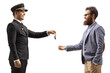 © Ljupco Smokovski - Parking valet giving car keys to a bearded man