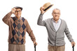 © Ljupco Smokovski - Two gentlemen with walking canes greeting with hats