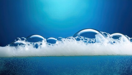 Poster - Close-Up of Glowing Soap Bubbles on Water Surface Against Vibrant Blue Background, Capturing the Ethereal Beauty and Transparency of Foam Forming an Iridescent Layer