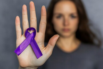 this symbol is meant to raise awareness of alzheimer's disease, domestic abuse, and cancer diseases.
