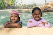 © Austockphoto - Aboriginal girls leaning on pool edge