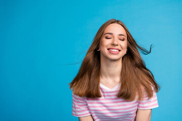 Poster - Photo portrait of adorable nice cheerful woman wear stylish striped pink clothes isolated on blue color background