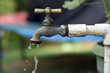 © Harold - Key with drops of water, water rationing, proper use of water, concept of scarcity of the precious liquid, drought, conservation of the planet,cop 16