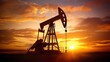 © Nathan - Silhouette of an oil pump jack against a stunning sunset, evoking the industrial spirit of energy production.