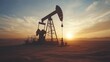 © Nathan - Silhouette of an oil pump jack against a vibrant sunset in a vast desert landscape.