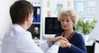 © H_Ko - Portrait of professional doctor hold patients hand and calm down after appointment. Senior woman in doctors cabinet, checkup health. Medicine, help concept
