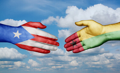 Guinea-Bissau and Puerto Rico country handshaking with flags, consensus concept international co-operation illustration