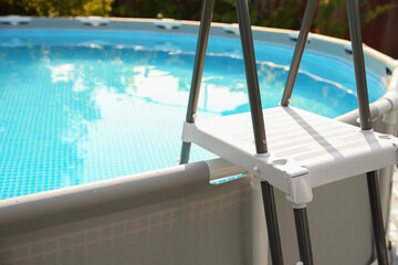 Canvas Print - Above ground swimming pool outdoors on sunny day, closeup