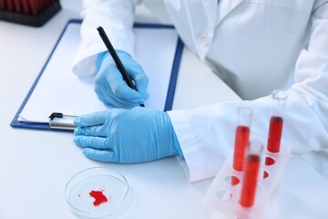 Wall Mural - Laboratory testing. Doctor working at white table indoors, closeup