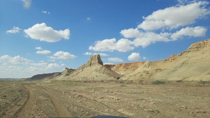 The deserted bottom of the dried up Aral Sea. Mountain range near the shore of a dry sea