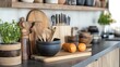 © Tcukimay - A kitchen countertop with wooden cutting boards, a black bowl, and a plant. There are also oranges on a wooden cutting board in the foreground.