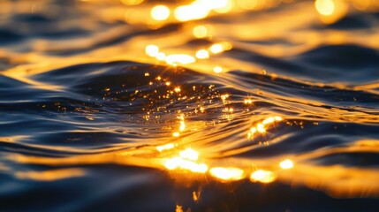 Poster - A close up of glistening golden light dancing upon the surface of undulating water