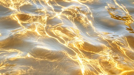 Poster - A close up of glistening golden light dancing upon the surface of undulating water