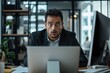 © Road Red Runner - A professional man experiences shock at his desk while reading a suspicious email about a deep fake scam in a modern office setting