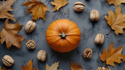 Poster - A decorative arrangement featuring a pumpkin, walnuts, and autumn leaves on a textured surface.