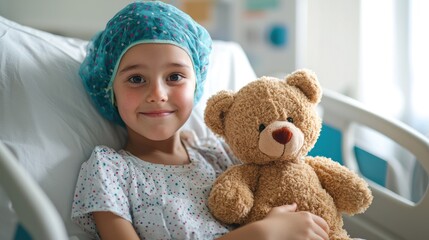 Pediatric patient with a brain tumor sitting in a hospital bed, holding a teddy bear.