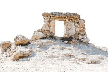 An ancient stone archway ruin sits amidst a white sandy desert landscape, its weathered stones and doorway hinting at a lost history.