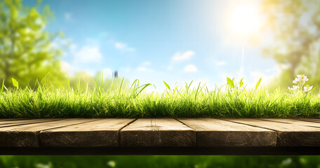 Canvas Print - A natural spring garden background of fresh green grass with a bright blue sunny sky with a wooden table to place cut out products on.