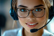 © Azazul - Happy call center woman wearing a headset in the office.