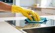 © tanya78 - hand in rubber glove cleaning kitchen, concept of cleanliness