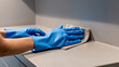 © tanya78 - hand in rubber glove cleaning kitchen, concept of cleanliness
