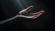 © Elmira - A hand extends outwards from the shadows, softly lit by a beam of light, creating a serene atmosphere that evokes feelings of hope and connection
