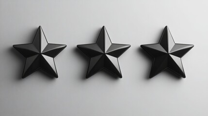 Fototapete - Three glossy black stars are positioned neatly in a line on a smooth gray surface, creating a contemporary and stylish visual effect that complements modern design aesthetics.