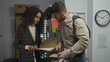 © Krakenimages.com - Woman and man investigators analyzing evidence in a police department office.