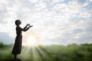 Wall Mural - Young girl praying to God