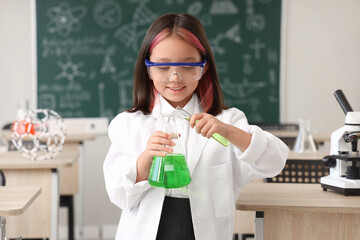 Poster - Cute little girl studying chemistry in science classroom