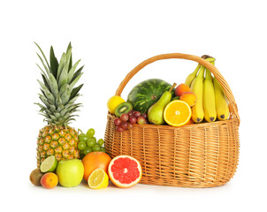 Poster - Many different fresh fruits in wicker basket isolated on white