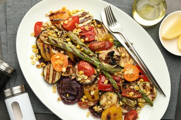 Delicious salad with grilled vegetables served on table, flat lay