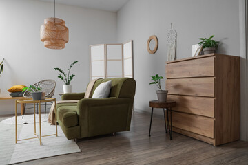 Sticker - Interior of light living room with mirror, green sofa and armchair