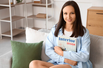 Sticker - Young woman with magazine sitting on sofa at home