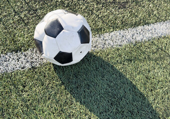 Wall Mural - top view of football on green field , soccer ball on grass