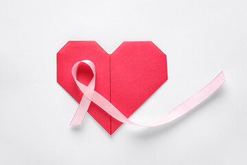 Wall Mural - Pink ribbon and heart on white background. World Cancer Day