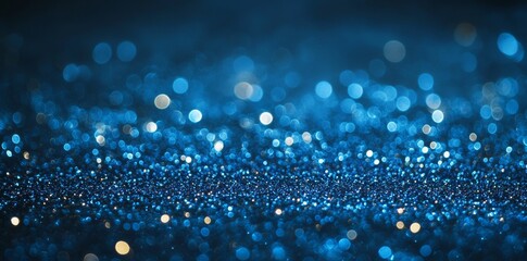 Detailed close-up of a blue glitter abstract background of a bright night sky with white sparkles